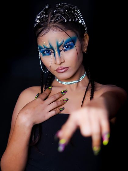 This shot highlights the neon-colored nail art, which adds another layer of creativity to the look.