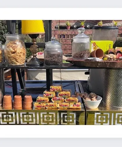 Another view of the charming tea and coffee counter, with jars of cookies and snacks ready to be enjoyed with a hot beverage.
