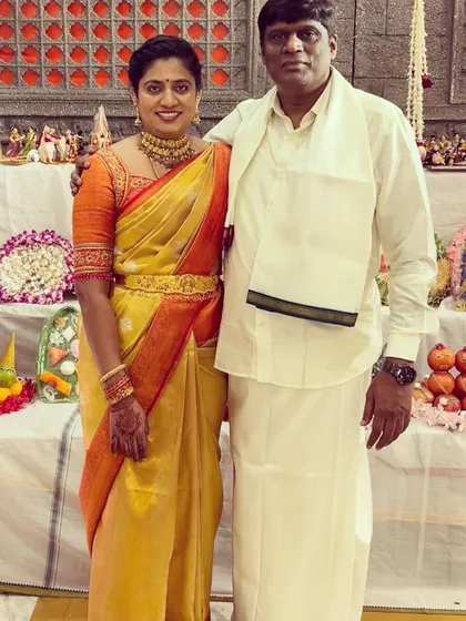A classic look for a traditional ceremony. I designed this orange blouse with detailed gold embroidery on the sleeves to complement the client's beautiful yellow and orange silk saree.