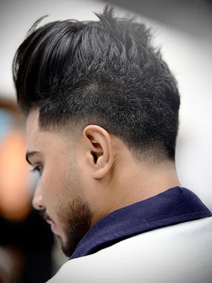 A perfect taper fade is all about precision. Look at the clean lines and seamless blend on this men's haircut. This is the kind of sharp, classic style that never fails to impress.