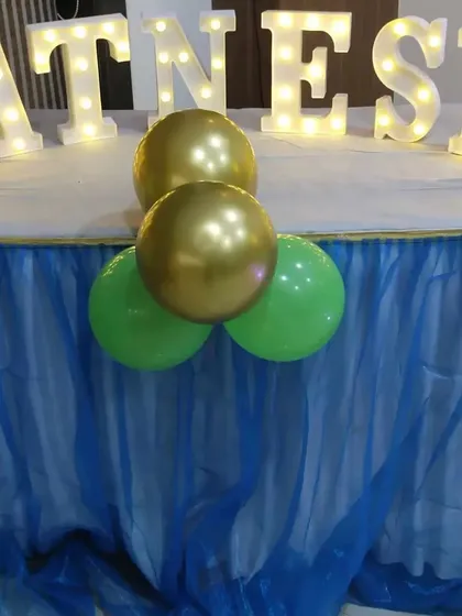 Light-up marquee letters spelling the birthday boy's name, part of the animal-themed party decor.