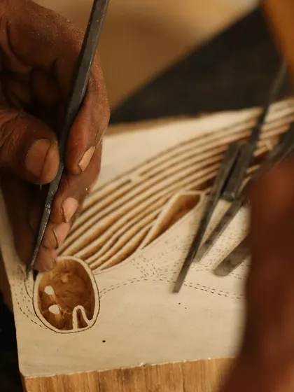 This is the story of a Yawkyawk (young woman mermaid) design by artist Janet Marawarr. Her original lino tile is being carefully translated into a woodblock by our carvers, preserving the story for our collaborative textile collection.