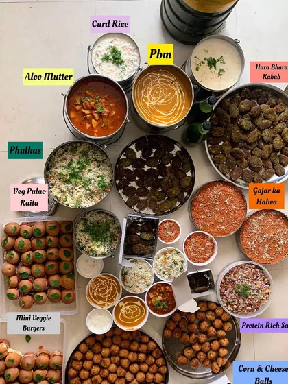 The first order of the year, a birthday party for 100+ people with a massive spread including Mini Veggie Burgers, Hara Bhara Kebabs, and Gajar ka Halwa.