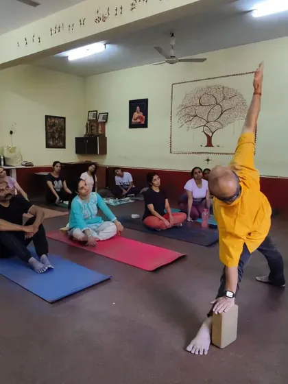 Teaching Trikonasana in a workshop.
