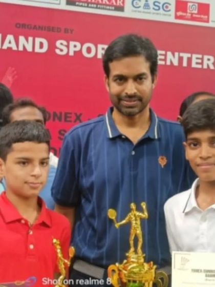 **Mentorship from a Legend.** Our champion Vedant Pahwa with the legendary Pullela Gopichand after his victory, a moment of inspiration for our young athlete.