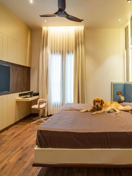 This view shows the integrated study desk and TV unit, creating a functional and stylish space for a young adult.