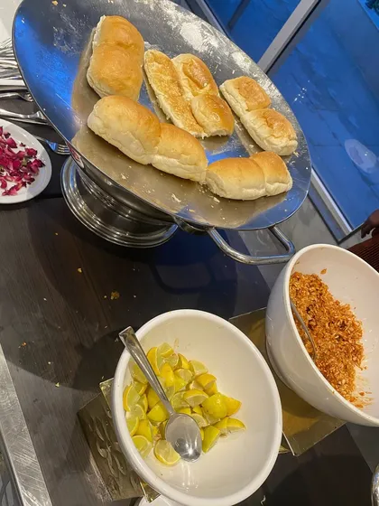 Soft pav bread, lightly toasted and ready to be paired with our flavorful bhaji, along with lemon and dry garlic chutney.