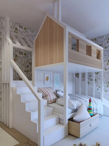 This treehouse-inspired bunk bed turns bedtime into an adventure. The design includes a sturdy staircase, a cozy lower bunk with under-bed storage, and a playful upper level, all in a clean white and natural wood finish.