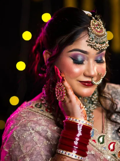 A beautiful closed-eye shot, showing the seamless blend of the eyeshadow and the glowing highlighter on the cheekbones.