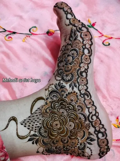 A stunning foot design featuring a large, intricate flower and a swan motif, combining grace and beauty.