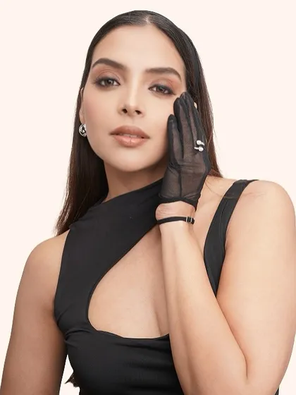 The soft glam makeup gives a timeless feel to this modern, fashion-forward shot.