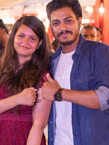 A couple posing for a photo at the concert.