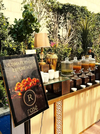 Our "Ultimate Chaat Experience" station set up for an outdoor event. The elegant counter, branded signage, and beautiful serveware demonstrate how we elevate traditional street food into a luxury experience.