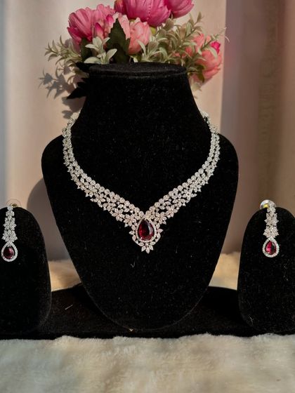 I believe every woman deserves new jewellery. This stunning American Diamond necklace with a central ruby-red stone is a perfect piece to treat yourself with.