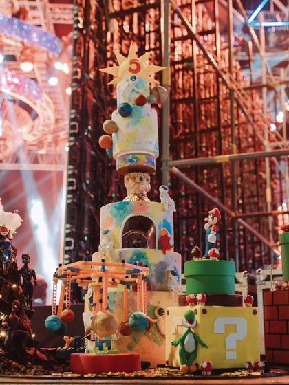 The absolutely breathtaking birthday cake for 'Sanay's Universe', combining elements from all the different themes into one towering, edible masterpiece.