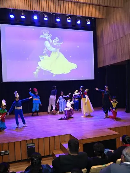 The grand finale of a fairytale play, with the entire cast taking a bow. This moment celebrates their collective effort and success.