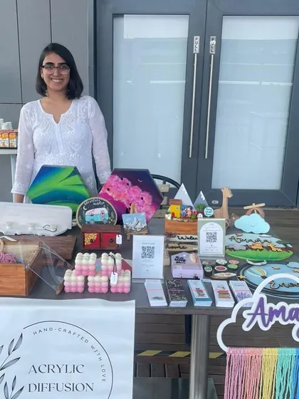 Here I am at my very first market stall. It was such a proud moment to display all my handcrafted decor and furniture. You can see a variety of my work, from name boards to decorative boxes.