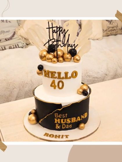 A chic black and white cake for a 40th birthday, celebrating the "Best Husband & Dad" with gold accents.