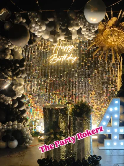The full view of the 41st birthday terrace party setup, showing the silver sequin wall, balloon arch, and marquee numbers creating a perfect photo backdrop.