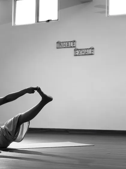 An artistic black and white photo of my practice in the shala, showing the clean, open space that allows for freedom of movement and mind.