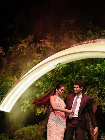 Sapni and Arjun share their first dance under a rainbow of light in Bali. This magical moment captures the romance and beauty of their tropical destination wedding.