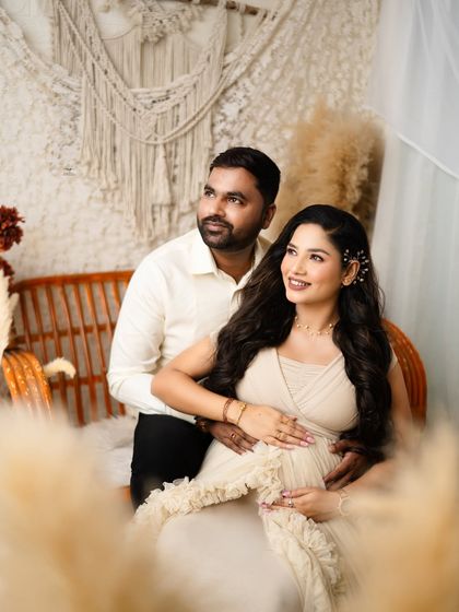 The couple looks away from the camera, as if dreaming of their future together. This candid-style pose feels natural and full of hope.
