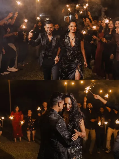 The couple's grand entrance to their cocktail party, walking through a tunnel of friends holding sparklers.