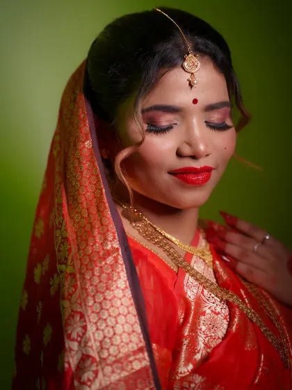 A close-up on the eye makeup, featuring a soft blend of warm tones and a sharp wing. These are the detailed techniques that elevate a bridal look.