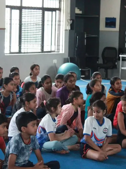 Our gymnasts patiently waiting for their turn to compete at the Dasara selection event. Their focus and discipline are commendable.