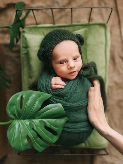 My hand is always near to ensure your baby is secure and comfortable. This image shows the gentle touch and careful handling that is central to every newborn session I conduct.