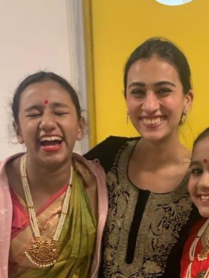 Sharing a laugh with two of my students backstage. Their happiness and camaraderie are as important as their performance.