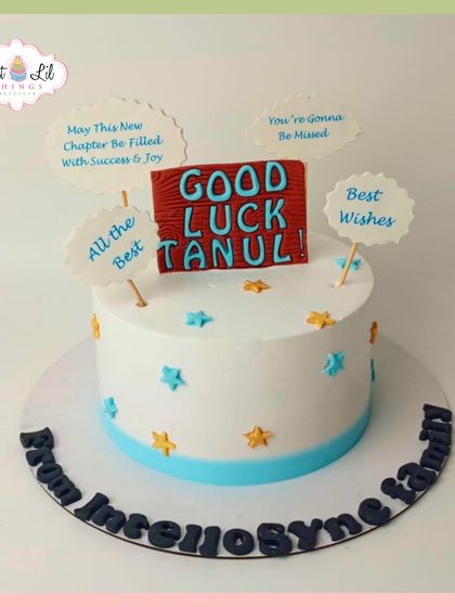 A sweet farewell cake for Tanul, with messages of "Good Luck" and "Best Wishes" for his new chapter.
