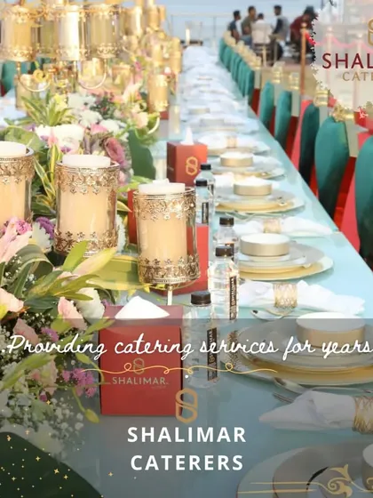 For years, we have been providing luxurious catering services. This long, exquisitely decorated table setup for an outdoor event showcases our ability to transform any space into a magnificent dining venue.