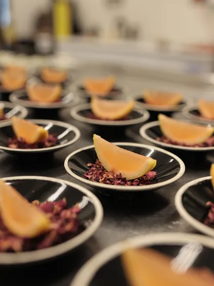 A tray of our beautiful rose and citrus palate cleansers, ready for service during an exclusive dinner.