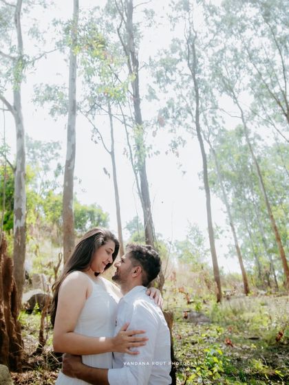 A walk in the woods becomes a romantic escape. I love using the soft, natural light filtering through the trees to create serene and intimate couple portraits.