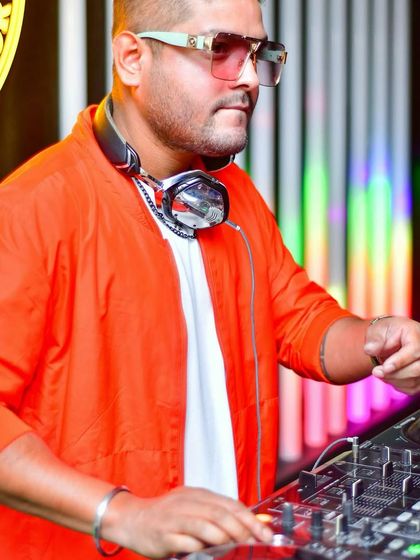 Rocking an orange bomber jacket for a Ladies' Night at End of the Day. The right look helps set the tone for a great party.