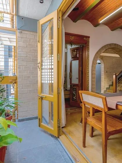 The dining area opens onto a small patio, perfect for growing herbs and plants.