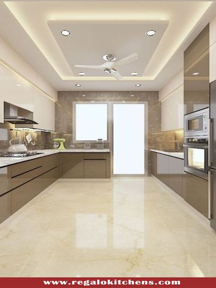 This parallel kitchen design is both spacious and efficient. The layout provides ample counter and storage space on both sides, with a mix of beige and brown tones creating a warm and inviting atmosphere.