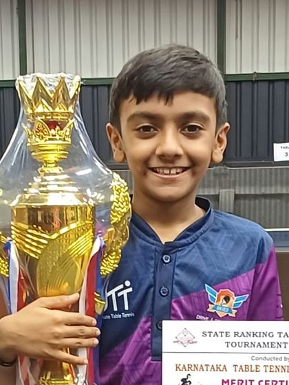 Arnav, our U-11 champion, proudly holding his trophy.