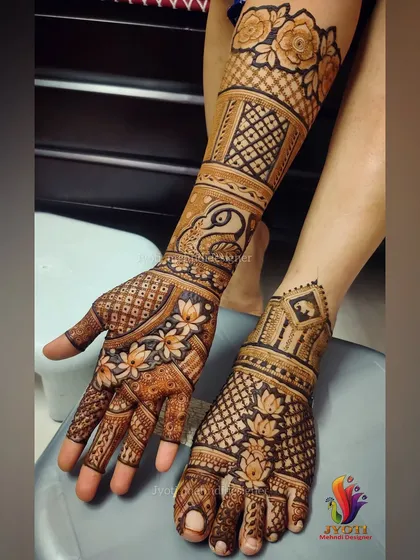 A beautiful example of a complete bridal set, with coordinated designs for both hands and feet. The patterns feature a mix of peacocks, lotuses, and traditional rose motifs.