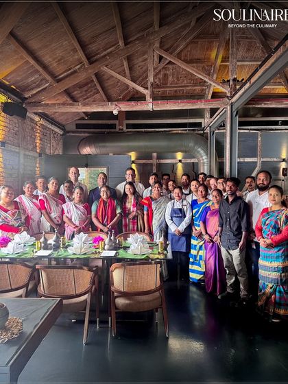 A group photograph of the entire team, including the tribal chefs, at the successful 'Forest to Feast' event. We believe in the power of collaboration to create extraordinary culinary moments.