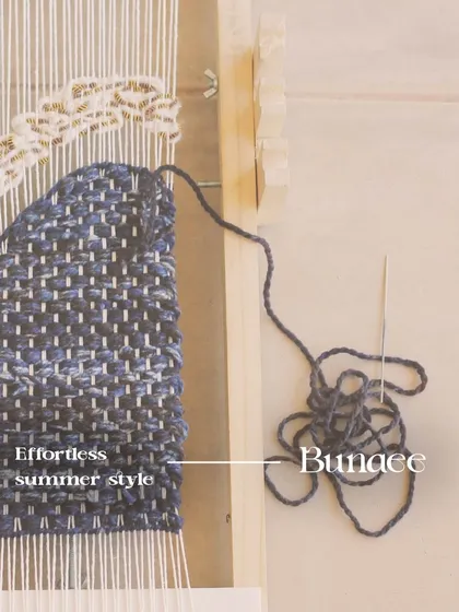 This is not fast fashion. This image shows the "Bunaee" or weaving process, highlighting the sustainable and impactful quality that comes from expert, handcrafted tailoring.