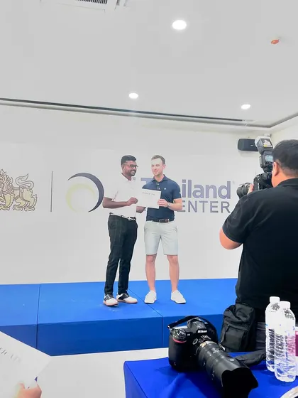 One of my senior coaches receiving a certificate at a high-performance coaching event in Thailand. I invest in my team's education to ensure they bring the best knowledge back to our athletes.