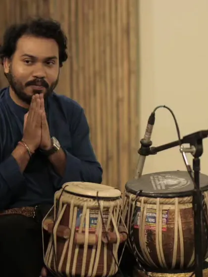 A series of photos from a baithak-style concert in Delhi with sarod player Pratik Shrivastav bhai. The intimate setting allows for a deeper connection with the audience.