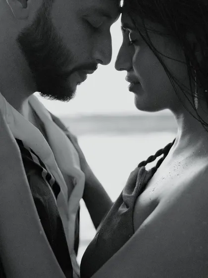 Sometimes, the most powerful stories are told in whispers. This quiet, black and white close-up from a beach shoot in Phuket strips away everything but the raw emotion and connection between two people.