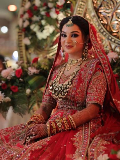 A gorgeous bride seated on her wedding stage. The makeup looks flawless even under the bright event lighting, which is something I always ensure.