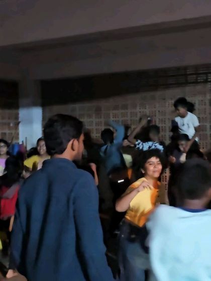 Students dancing and enjoying themselves during a party at the dojo.