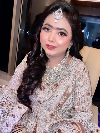 Another shot of this beautiful reception look. The soft curls and the stunning diamond jewelry complete this elegant and glamorous style.