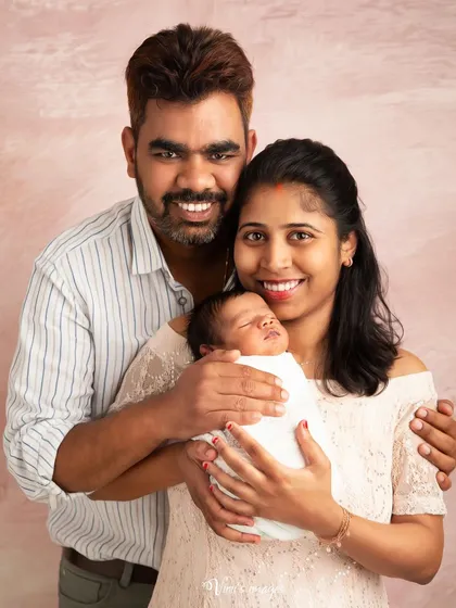 The joy of new parenthood shines through in this portrait. I always encourage parents to be in the photos, as these images become priceless treasures as your child grows.
