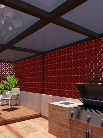 A 3D render of a terrace with an outdoor kitchen and BBQ. The space is defined by a glass pergola and a decorative red jaali wall, creating a stylish and functional area for cooking and dining.